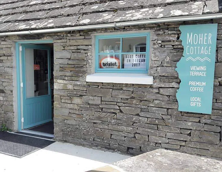 Moher Cottatge entryway with blue door and window