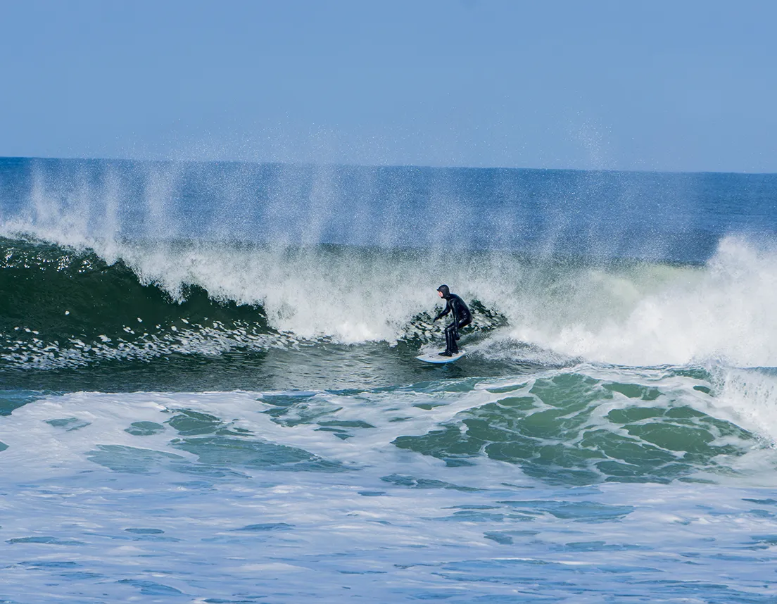 Man surfing in intense waves