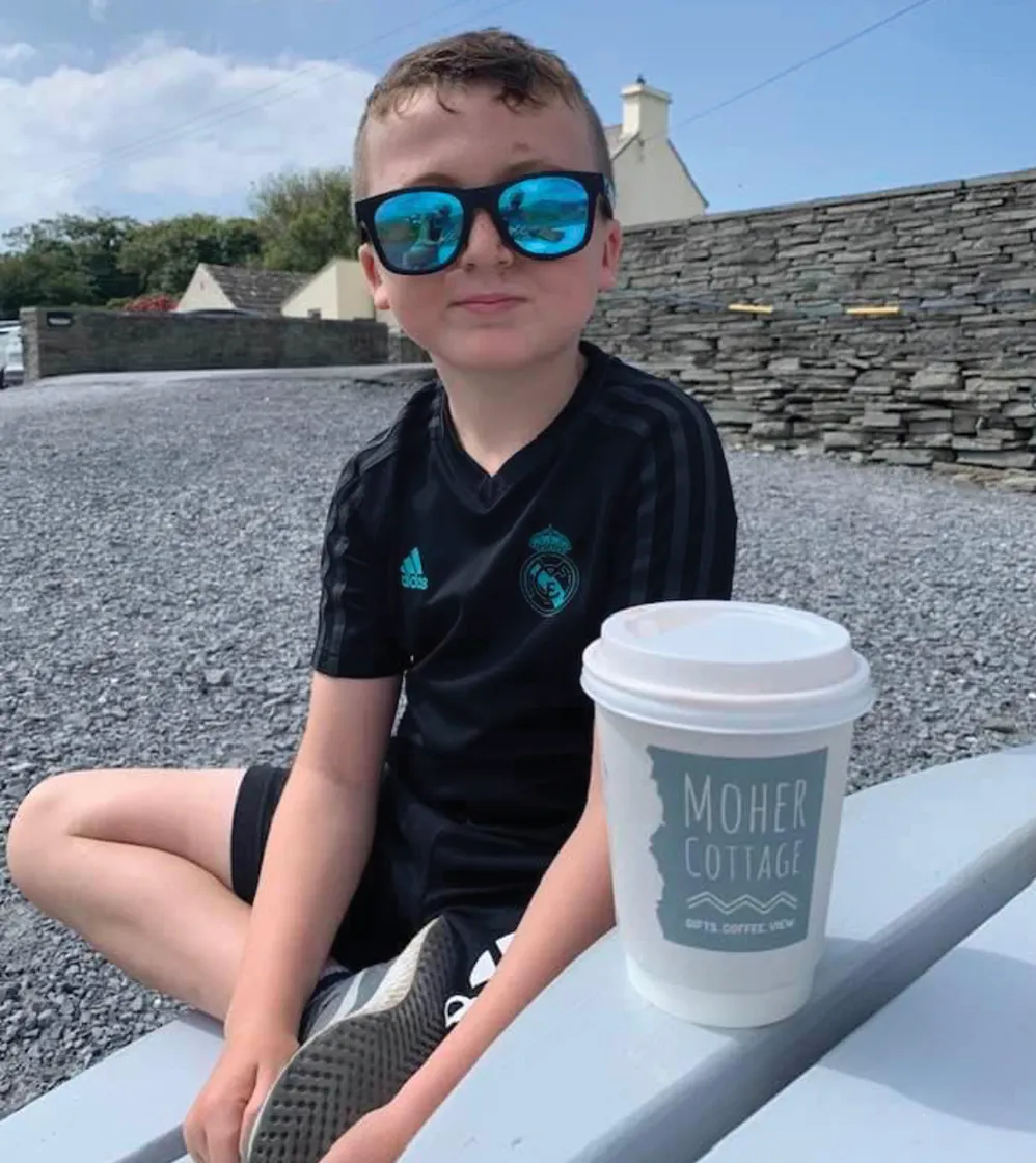 Boy with sunglasses at moher cottage