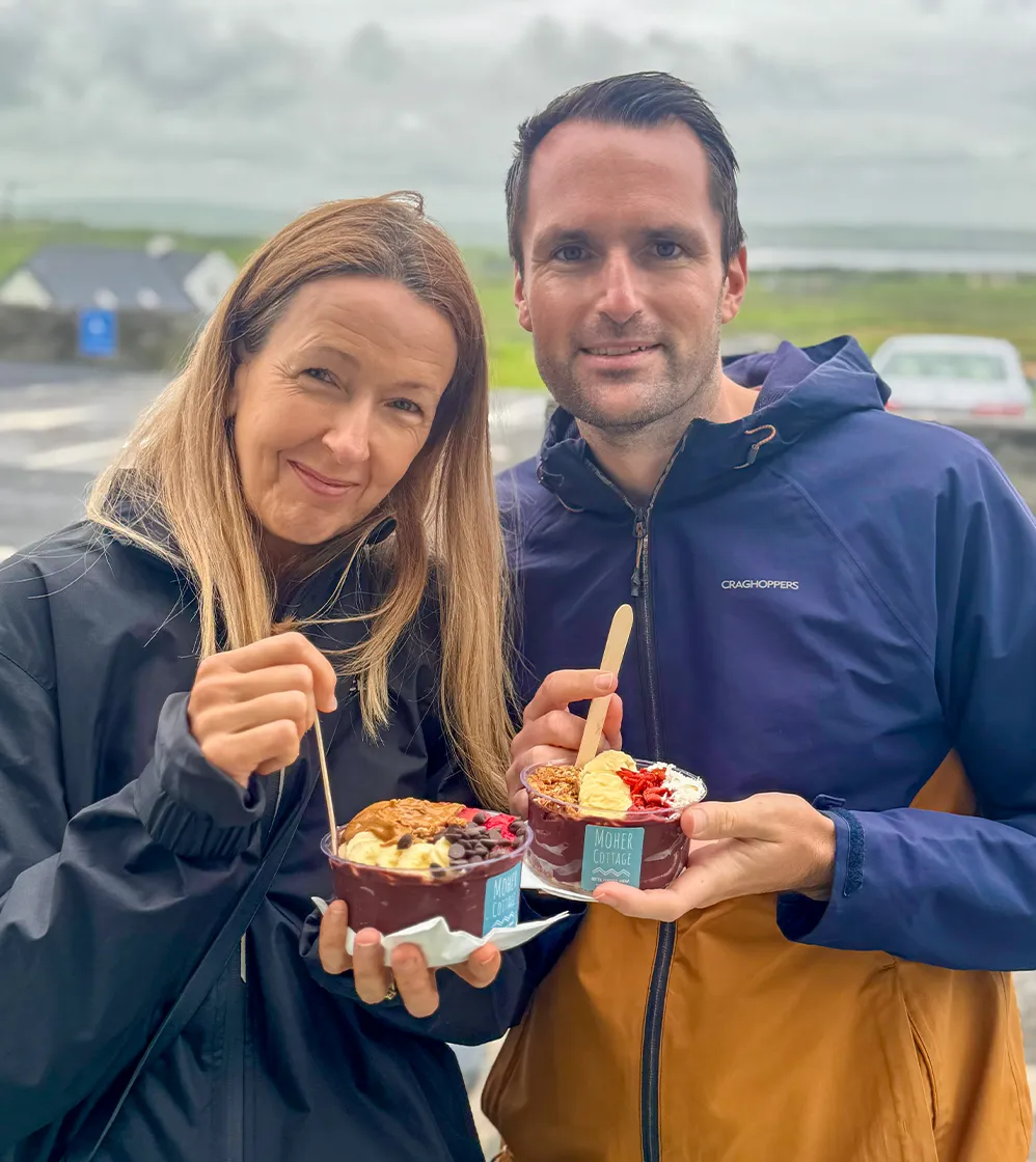 Man and woman enjoing moher cottage treat