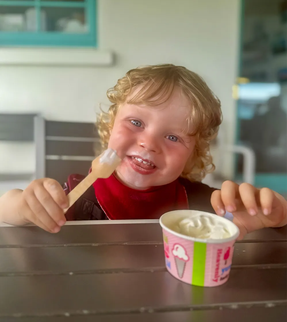 Small child enjoying ice cream